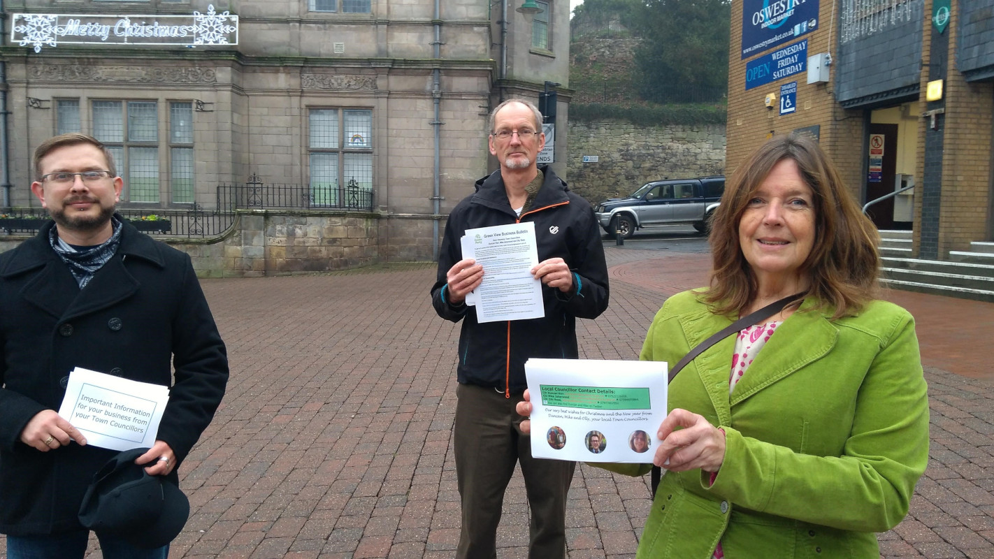 Green councillors with newsletter