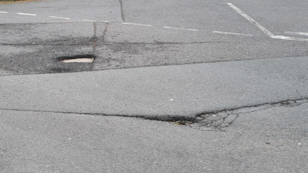 Potholes in a road